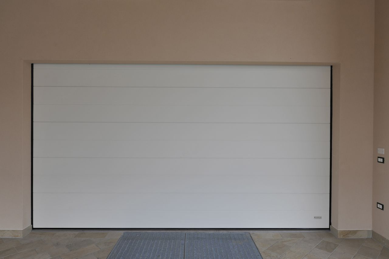 puerta seccional panel liso bis