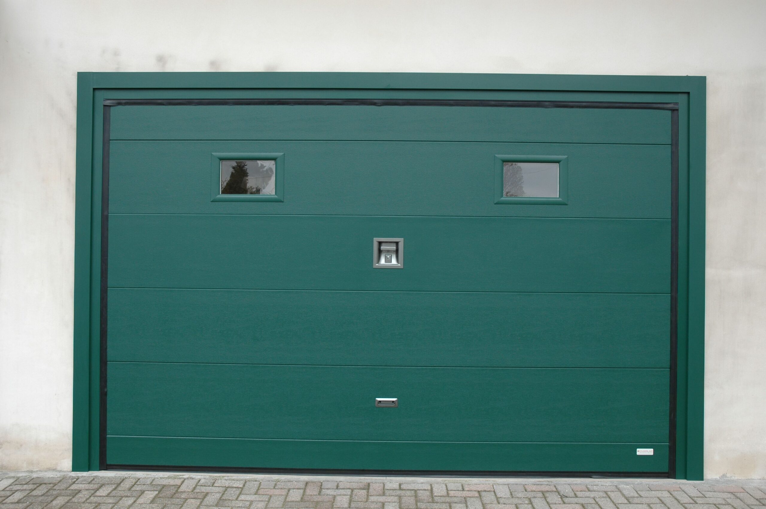 puerta seccional panel liso verde